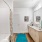 Model bathroom at our apartments for rent in Prosper, TX, featuring wood grain floor paneling and a shower / bath combo.